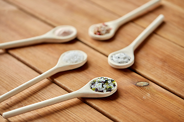 Image showing spoons with salt and spices on wooden table