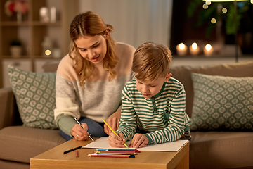 Image showing mother and son with pencils drawing at home