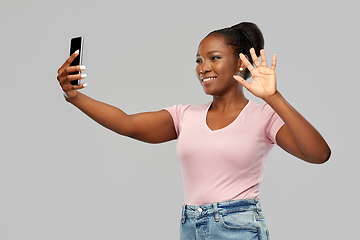 Image showing african american woman taking selfie by smartphone