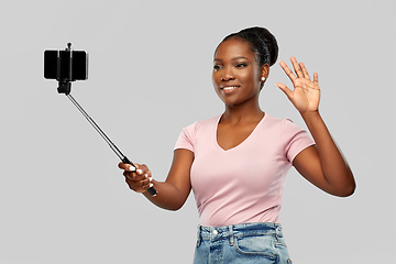 Image showing african american woman taking selfie by smartphone