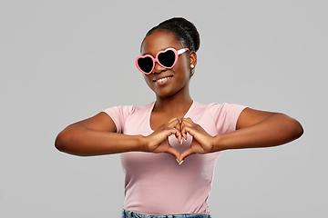 Image showing african american woman in heart-shaped sunglasses