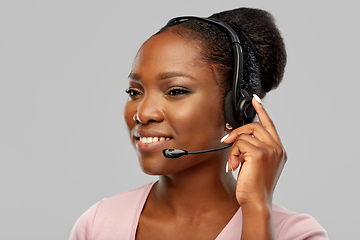 Image showing african american woman in headset with microphone