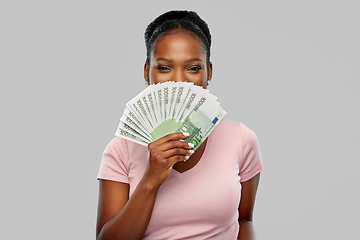 Image showing happy african american woman with euro money