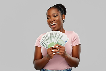 Image showing happy african american woman with euro money