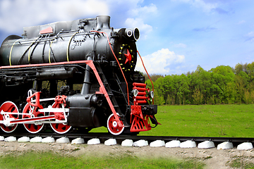Image showing black steam locomotive goes fast