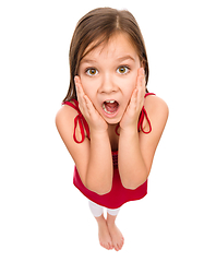 Image showing Little girl is holding her face in astonishment