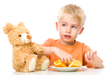 Image showing Portrait of a little boy with his teddy bear