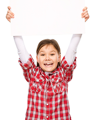 Image showing Little girl is holding a blank banner