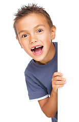 Image showing Little boy is looking out from the blank banner