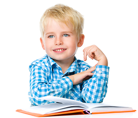 Image showing Little child play with book