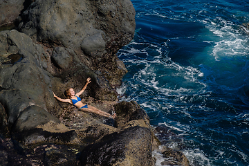 Image showing beautiful girl resting in natural ocean swimming pool