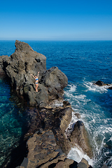 Image showing beautiful girl resting in natural ocean swimming pool