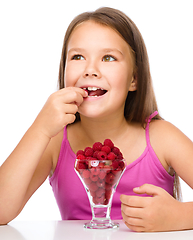 Image showing Little girl with raspberries