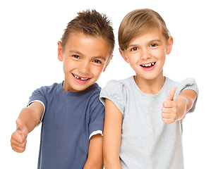 Image showing Little boy and girl are showing thumb up sign