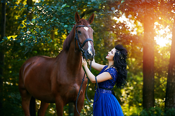 Image showing beautiful girl in dress with horse