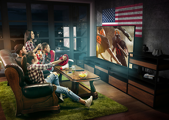 Image showing Group of friends watching TV, american football championship
