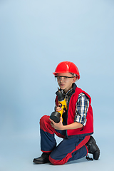 Image showing Boy dreaming about future profession of engineer