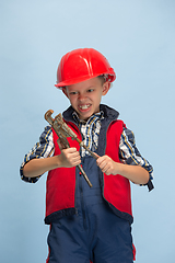 Image showing Boy dreaming about future profession of engineer