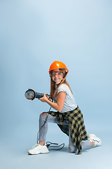 Image showing Girl dreaming about future profession of engineer