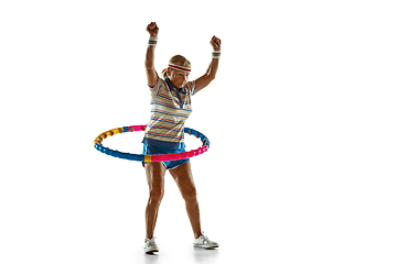 Image showing Senior woman training with hoop in sportwear on white background