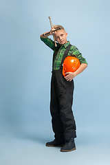 Image showing Boy dreaming about future profession of engineer