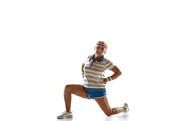 Image showing Senior woman training like athlete in sportwear on white background
