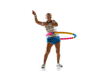 Image showing Senior woman training with hoop in sportwear on white background