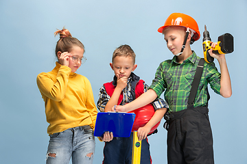 Image showing Kids dreaming about future profession of engineer