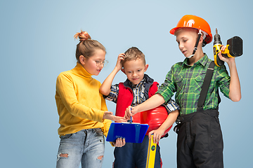 Image showing Kids dreaming about future profession of engineer