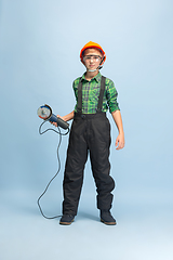 Image showing Boy dreaming about future profession of engineer