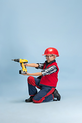 Image showing Boy dreaming about future profession of engineer