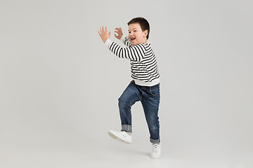 Image showing Caucasian boy isolated on white studio background. Copyspace. Childhood, education, emotions concept