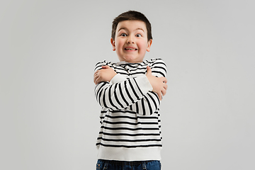 Image showing Caucasian boy isolated on white studio background. Copyspace. Childhood, education, emotions concept