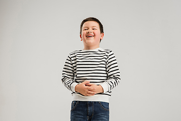 Image showing Caucasian boy isolated on white studio background. Copyspace. Childhood, education, emotions concept