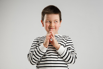 Image showing Caucasian boy isolated on white studio background. Copyspace. Childhood, education, emotions concept