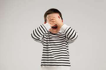 Image showing Caucasian boy isolated on white studio background. Copyspace. Childhood, education, emotions concept