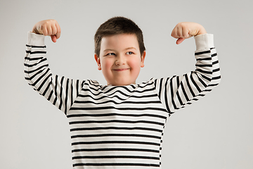 Image showing Caucasian boy isolated on white studio background. Copyspace. Childhood, education, emotions concept