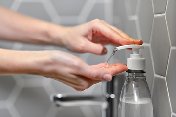 Image showing close up of woman washing hands with liquid soap