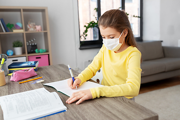 Image showing student girl in medical mask learning at home