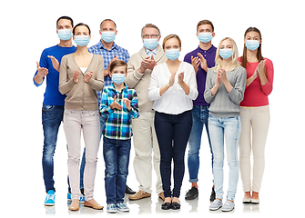 Image showing people in medical masks applauding