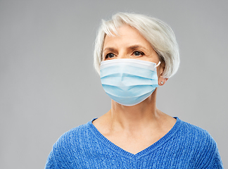 Image showing senior woman in protective medical mask