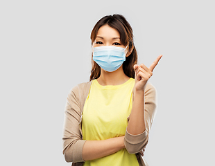 Image showing asian young woman in protective medical mask