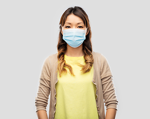 Image showing asian young woman in protective medical mask