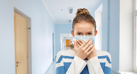 Image showing teenage girl in protective medical mask at school