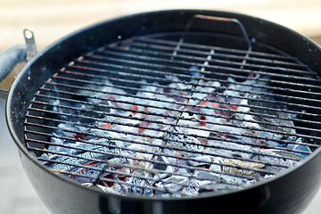 Image showing charcoal smoldering in brazier outdoors