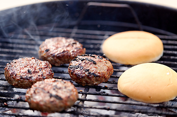 Image showing burger meat cutlets roasting on barbecue grill