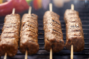 Image showing close up of barbecue kebab meat roasting on grill