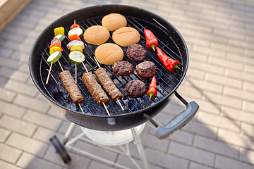 Image showing barbecue kebab meat and vegetables on grill