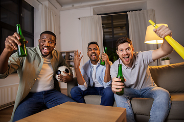 Image showing friends or soccer fans with ball and beer at home