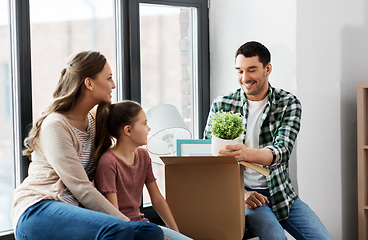 Image showing happy family with child moving to new home